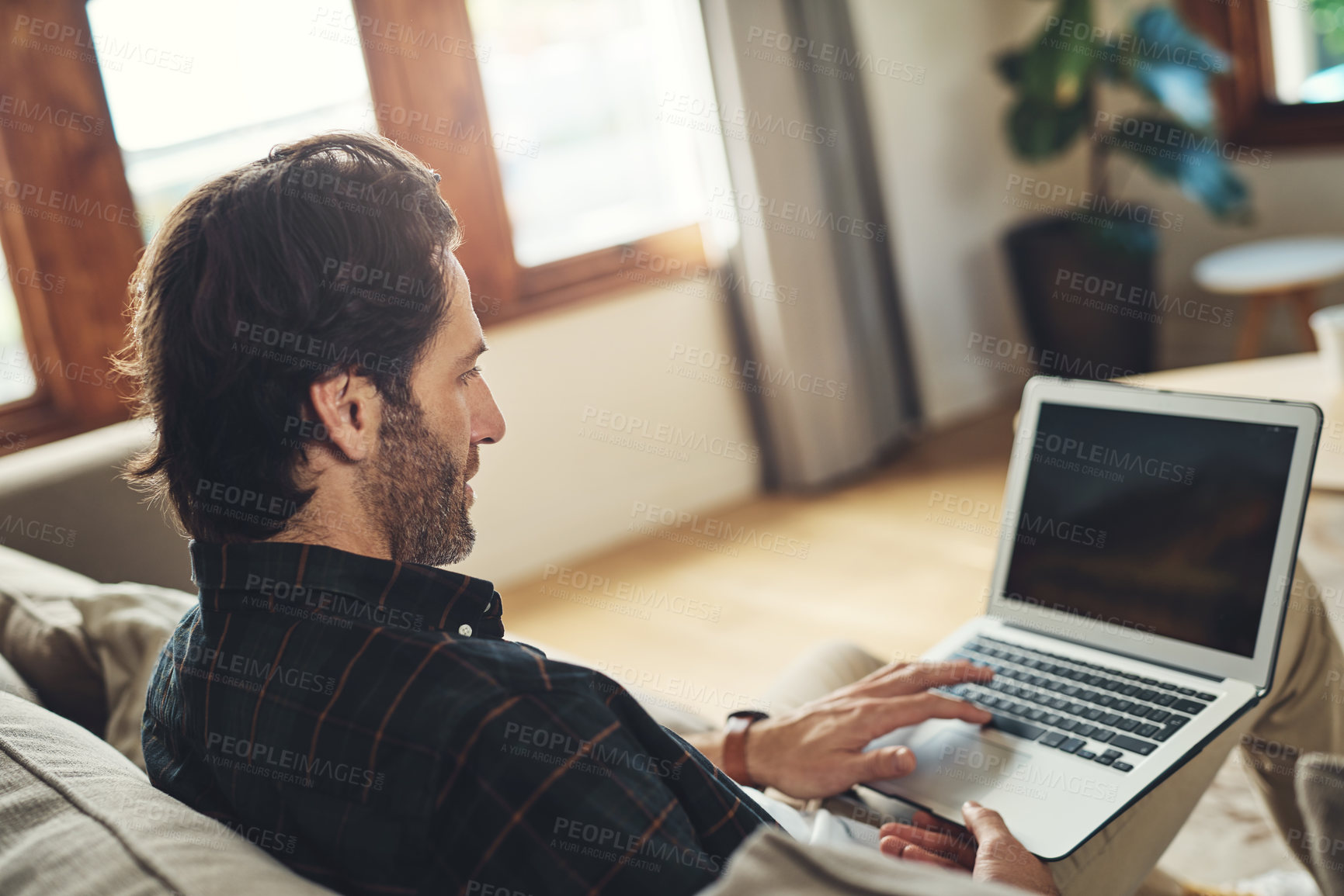 Buy stock photo Home, relax and man with laptop screen on sofa for communication, network and internet connectivity. Weekend, application and person with mockup on tech for job search, website and online information