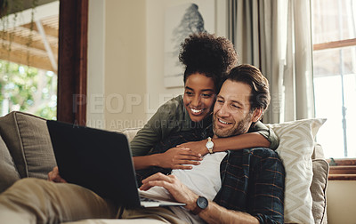 Buy stock photo Laptop, streaming and an interracial couple watching a movie using an online subscription service for entertainment. Computer, relax or internet with a man and woman bonding together over a video