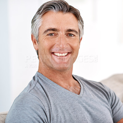 Buy stock photo Headshot portrait of a handsome mature man smiling while looking at the camera during the day