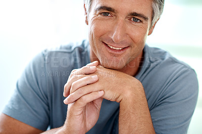 Buy stock photo Headshot portrait of a handsome mature man smiling while looking at the camera during the day