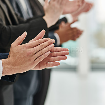 Buy stock photo Cropped shot of a group of unrecognizable  businesspeople clapping while standing in a row in an office