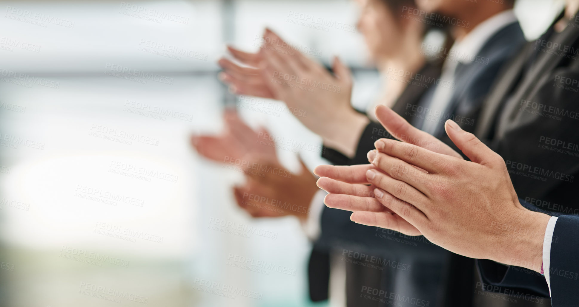 Buy stock photo Cropped shot of a group of unrecognizable businesspeople clapping while standing in a row in an office