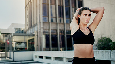 Buy stock photo Stretching, woman and building in city for exercise, fitness and wellness in sportswear in day. Warm up, walkway and workout in urban town for cardio, goals and challenge by skyscraper in New York