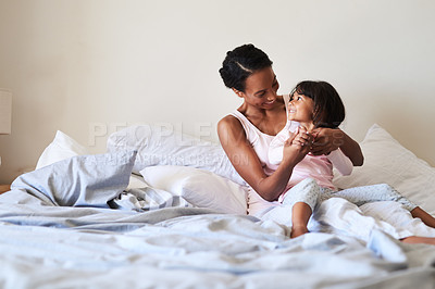 Buy stock photo Home, bedroom and mother with girl, hug and happiness with love, care and bonding together. Apartment, family and single parent with mama, daughter and cheerful with joy, morning or child development