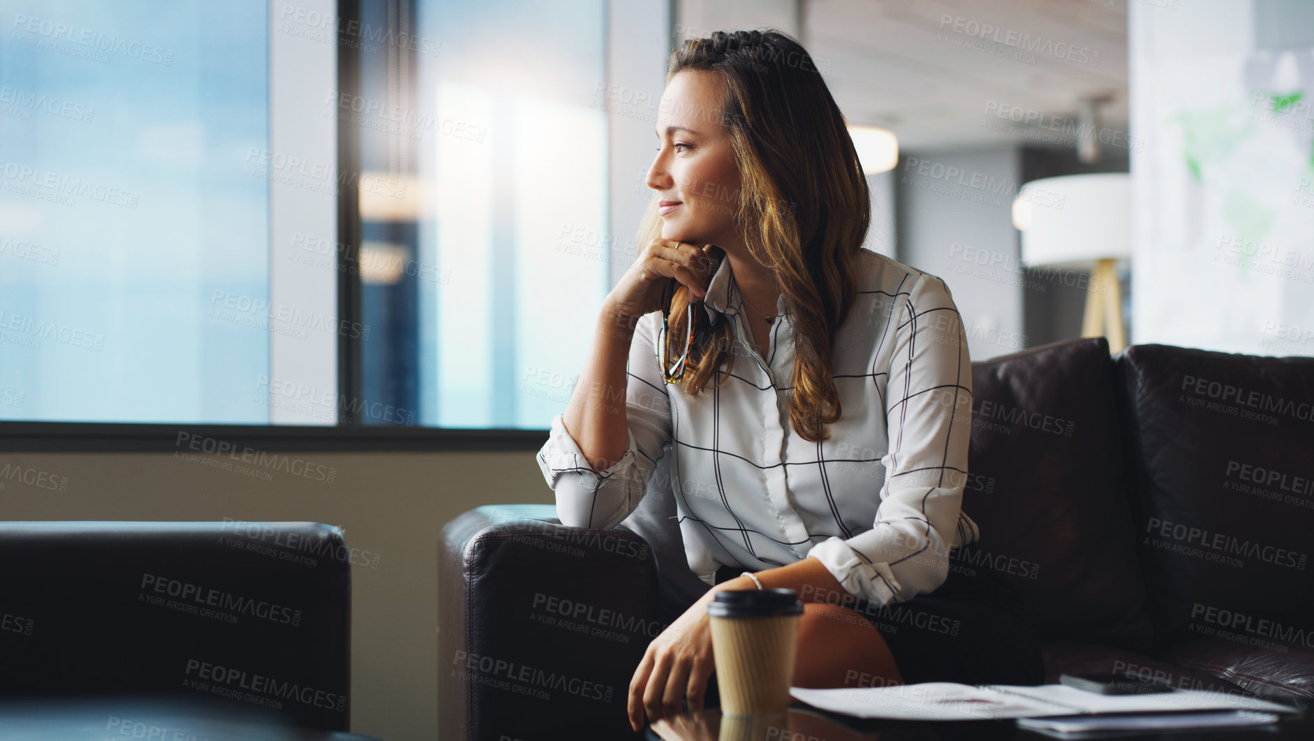 Buy stock photo Cropped shot of a businesswoman looking thoughtful while sitting in a modern office