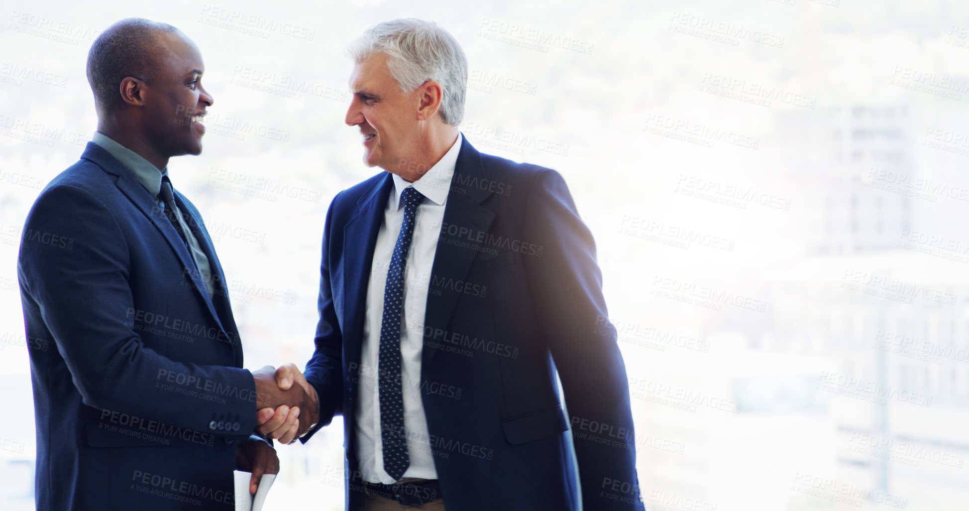 Buy stock photo Cropped shot of two businesspeople shaking hands