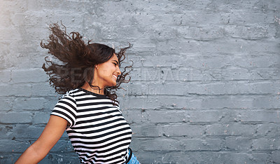 Buy stock photo Brick, wall and dance of girl, hair and outdoor for freedom, smile and break in weekend for fun. Dancer, person and happiness for holiday, summer and goofy in streetwear, tshirt and clothes in USA