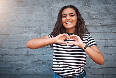 Buy stock photo Brick, wall and heart for girl, smile and hands for gesture, outdoor and break for weekend. Proud, excited and student on holiday, morning and happiness on face, model and city of New York with time