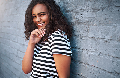 Buy stock photo Girl, portrait and smile or city brick wall with laughing humor or funny joke for traveling vacation, confidence or downtown. Female person, face and happy in New York for weekend, outdoor or urban