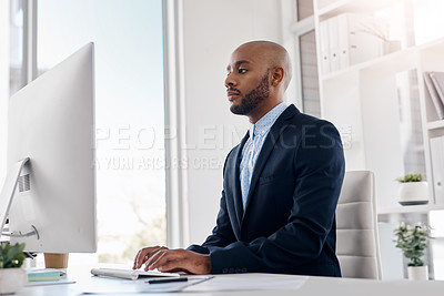 Buy stock photo Business office, black man and typing on computer for email, budget update or finance proposal. Desktop, employee or writing report for corporate project, online research or reading sales information