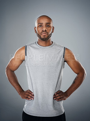 Buy stock photo Portrait, black man and confident in studio for fitness, workout and exercise on gray background. Male person, serious and trainer with sportswear with training for health and self care in Uganda