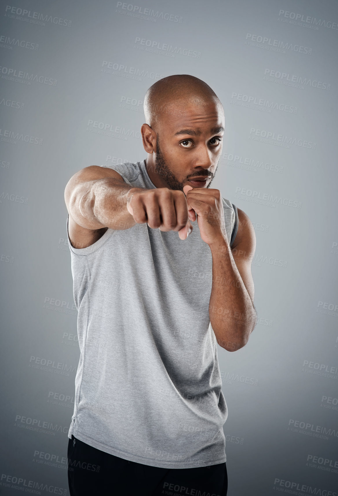 Buy stock photo Black man, portrait and fist for boxing in studio, fighter and battle or warrior on gray background. Male person, punch exercise and martial arts training, sports challenge and boxer for workout