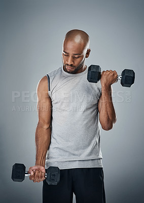 Buy stock photo Black man, dumbbells and practice training in studio, sports performance and lift on gray background. Male person, strong bicep challenge and weightlifting for power, bodybuilder and fitness workout