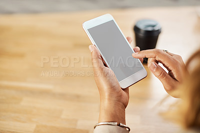 Buy stock photo Shot of an unrecognizable businesswoman using a cellphone while working in her office