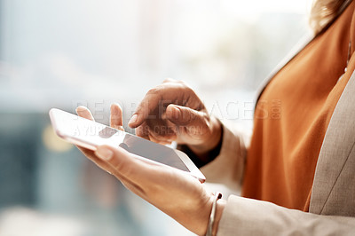 Buy stock photo Shot of an unrecognizable  businesswoman using a mobile phone in her office