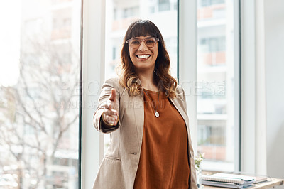 Buy stock photo Portrait of a cheerful young businesswoman reaching out for a handshake in her office