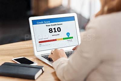 Buy stock photo Shot of an unrecognizable businesswoman using a laptop to check her credit score online in her office