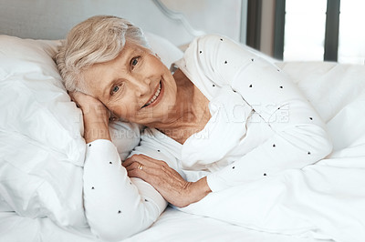 Buy stock photo Shot of a senior woman relaxing in bed in a nursing home