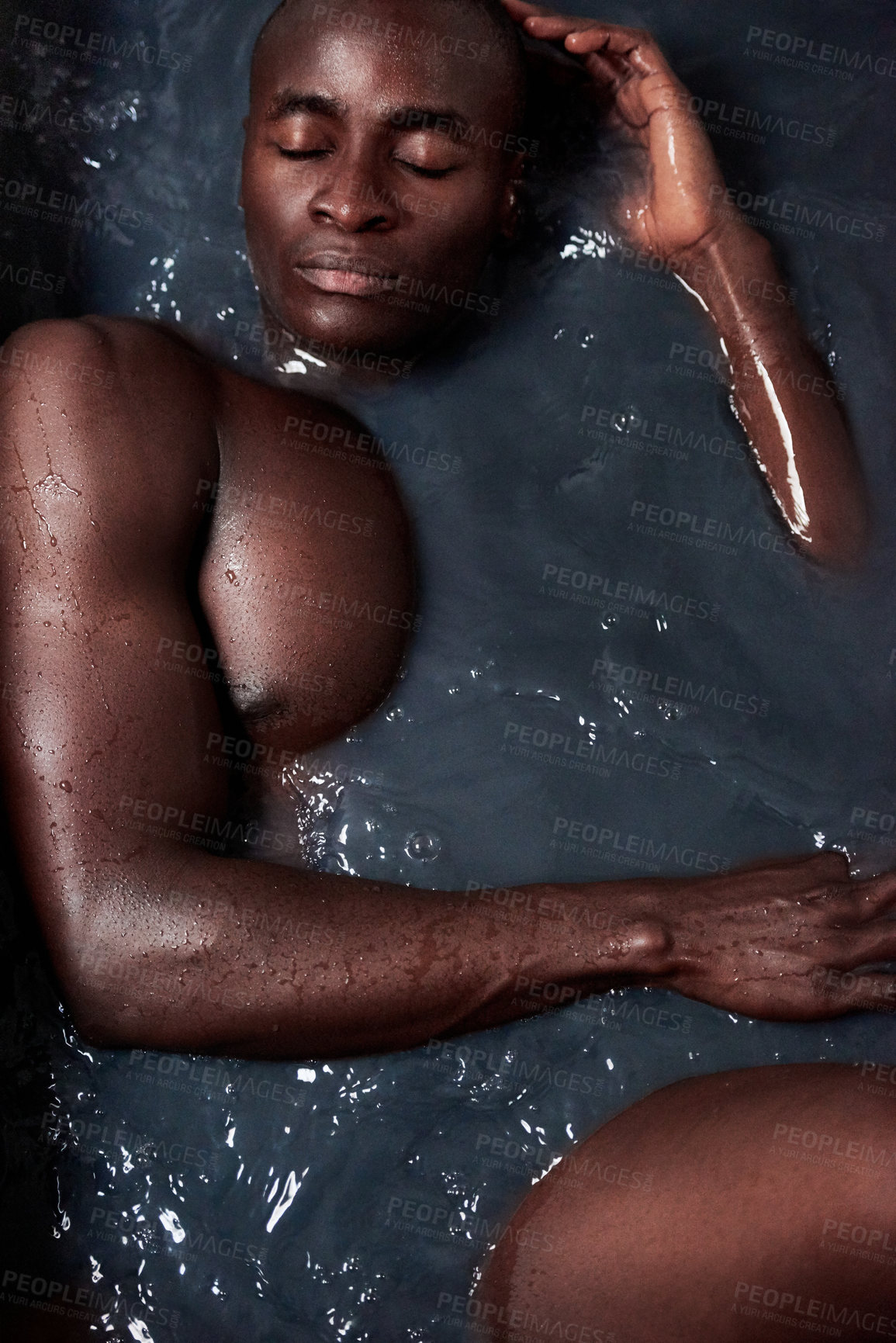 Buy stock photo Black man, water and bath for relax or beauty with eyes closed, detox and muscular in hot tub. Male person, skin care and dark liquid for art deco, luxury and naked for cleansing and cosmetics