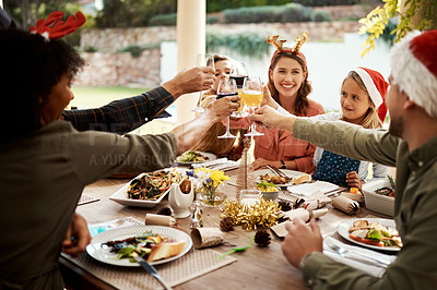 Buy stock photo Cropped shot of a family making a toast on Christmas day