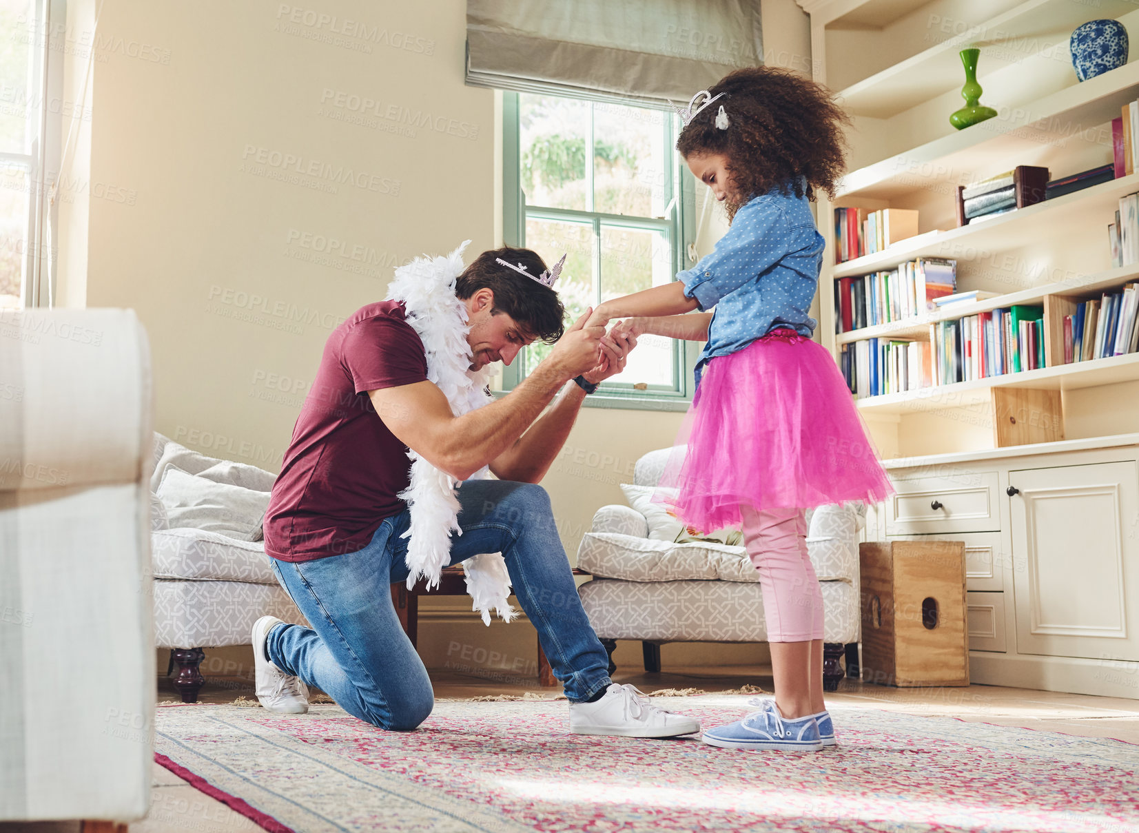 Buy stock photo Full length shot of a happy young father playing dress up with his daughter at home