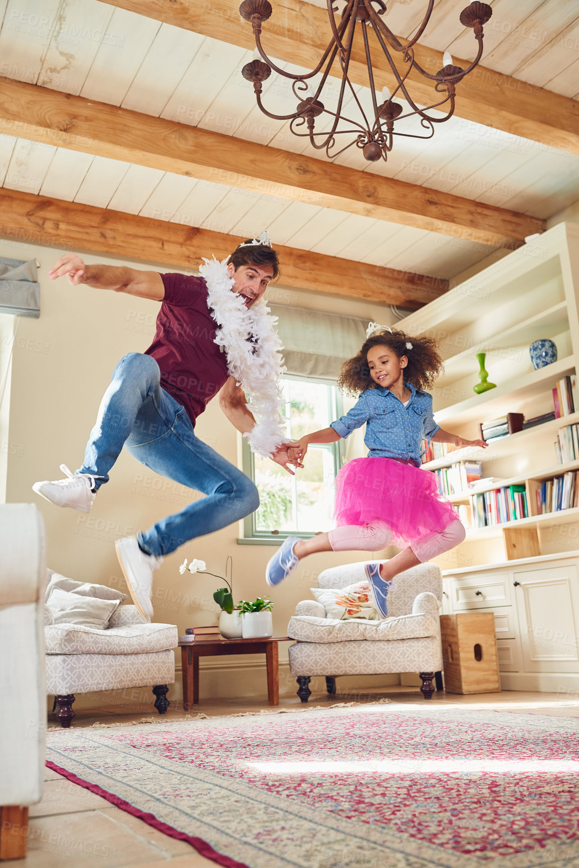 Buy stock photo Full length shot of a happy young father playing dress up with his daughter at home