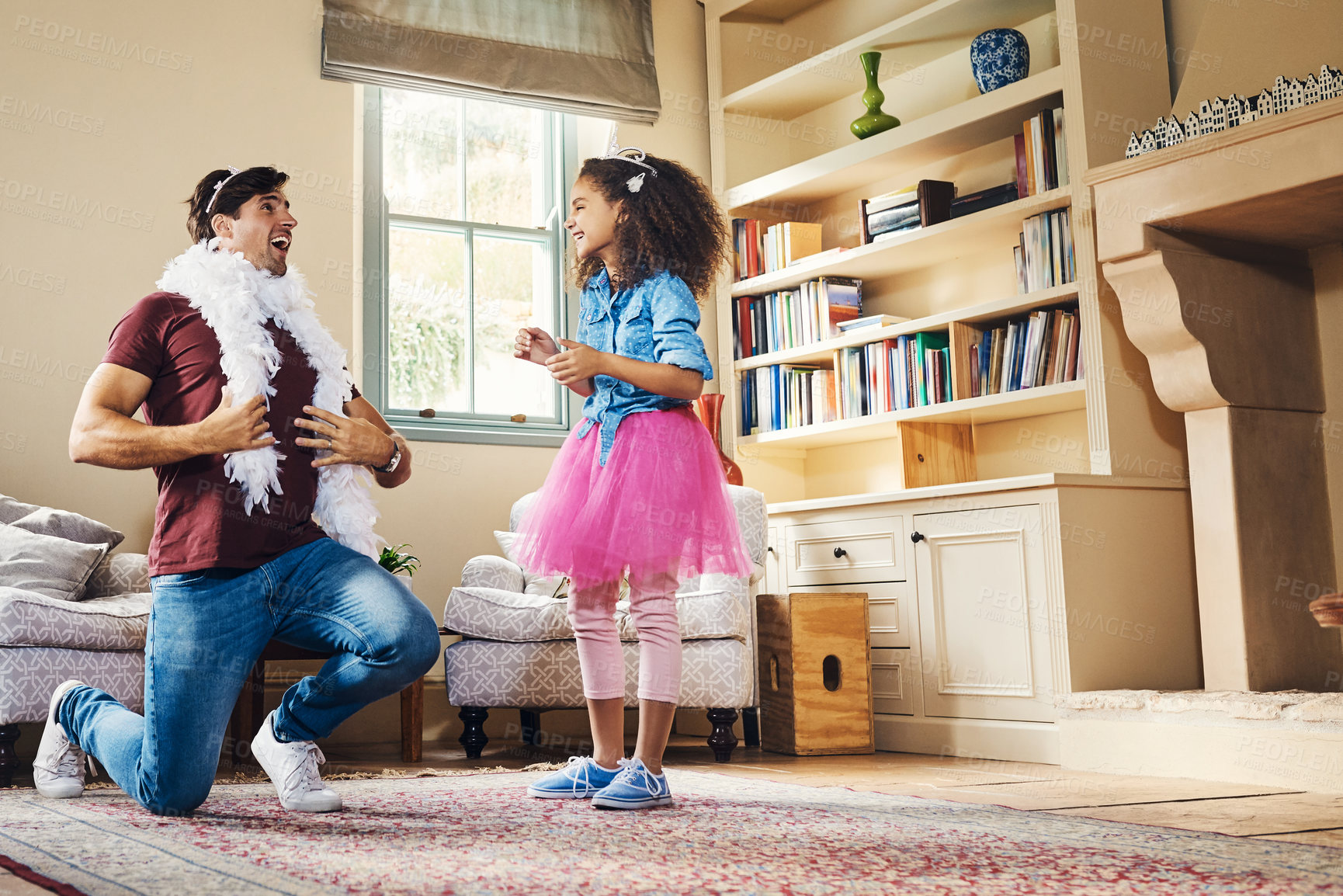 Buy stock photo Full length shot of a happy young father playing dress up with his daughter at home