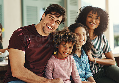 Buy stock photo Portrait of a beautiful young family posing together at home