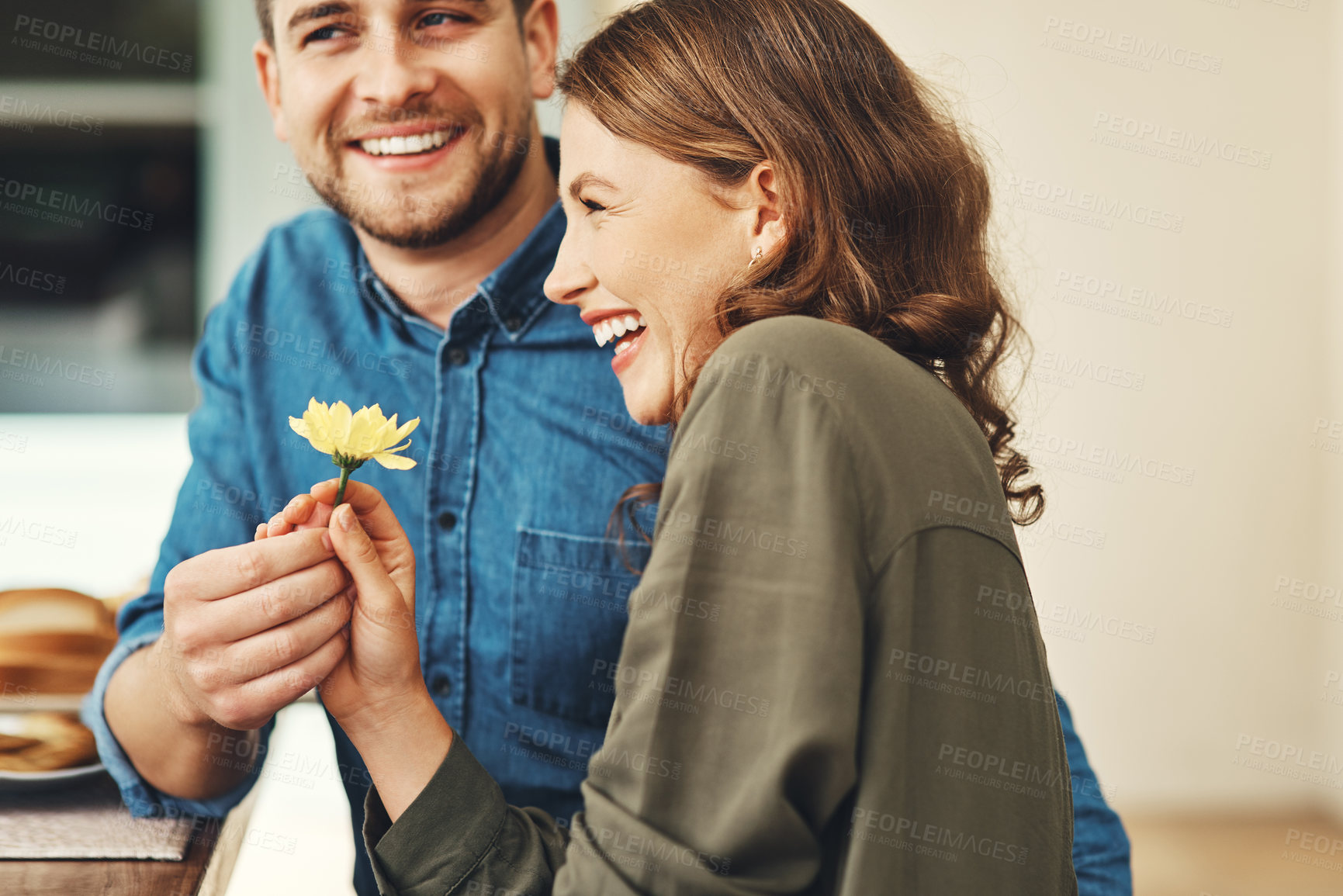 Buy stock photo Shot of an affectionate young couple enjoying themselves on their date outdoors