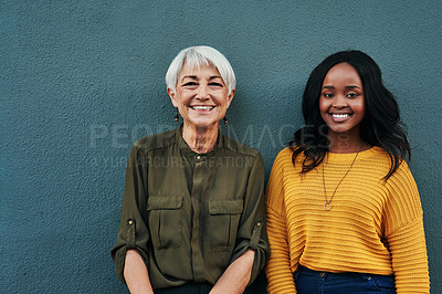 Buy stock photo Happy, diversity and portrait of women on a blue background for success, happiness and work. Smile, business and a young and senior employee standing on a wall for a professional career profile