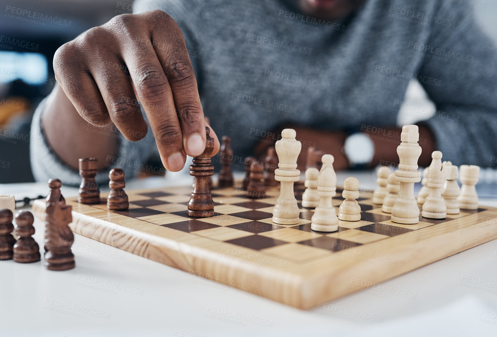 Buy stock photo Closeup, hands and man playing chess, strategy and thinking with pieces, concentration and challenge. Zoom, male person and player with a game, hobby and activity for fun, recreation and chessboard