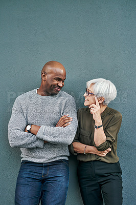 Buy stock photo Professional, talking and wall with blue background have a discussion at work with a friend. Man, woman and business, friendship on outdoor have a conversation about commitment and teamwork. 