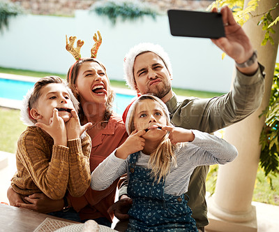 Buy stock photo Family, playful and selfie for Christmas, bonding and joy outdoor with fun, smile and pool in backyard. Mom, dad and children for holiday, celebration and funny face with support, memory and embrace