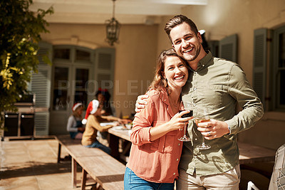 Buy stock photo Cropped shot of an affectionate couple posing together while enjoying a glass of wine