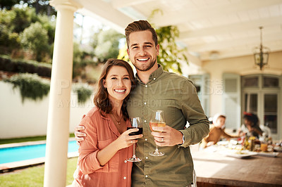 Buy stock photo Cropped shot of an affectionate couple posing together while enjoying a glass of wine