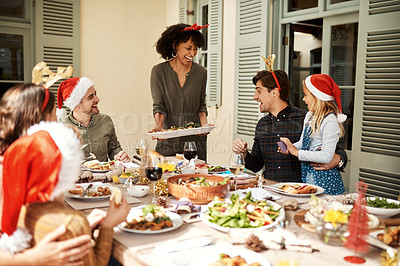 Buy stock photo Cropped shot of a happy family having Christmas lunch together