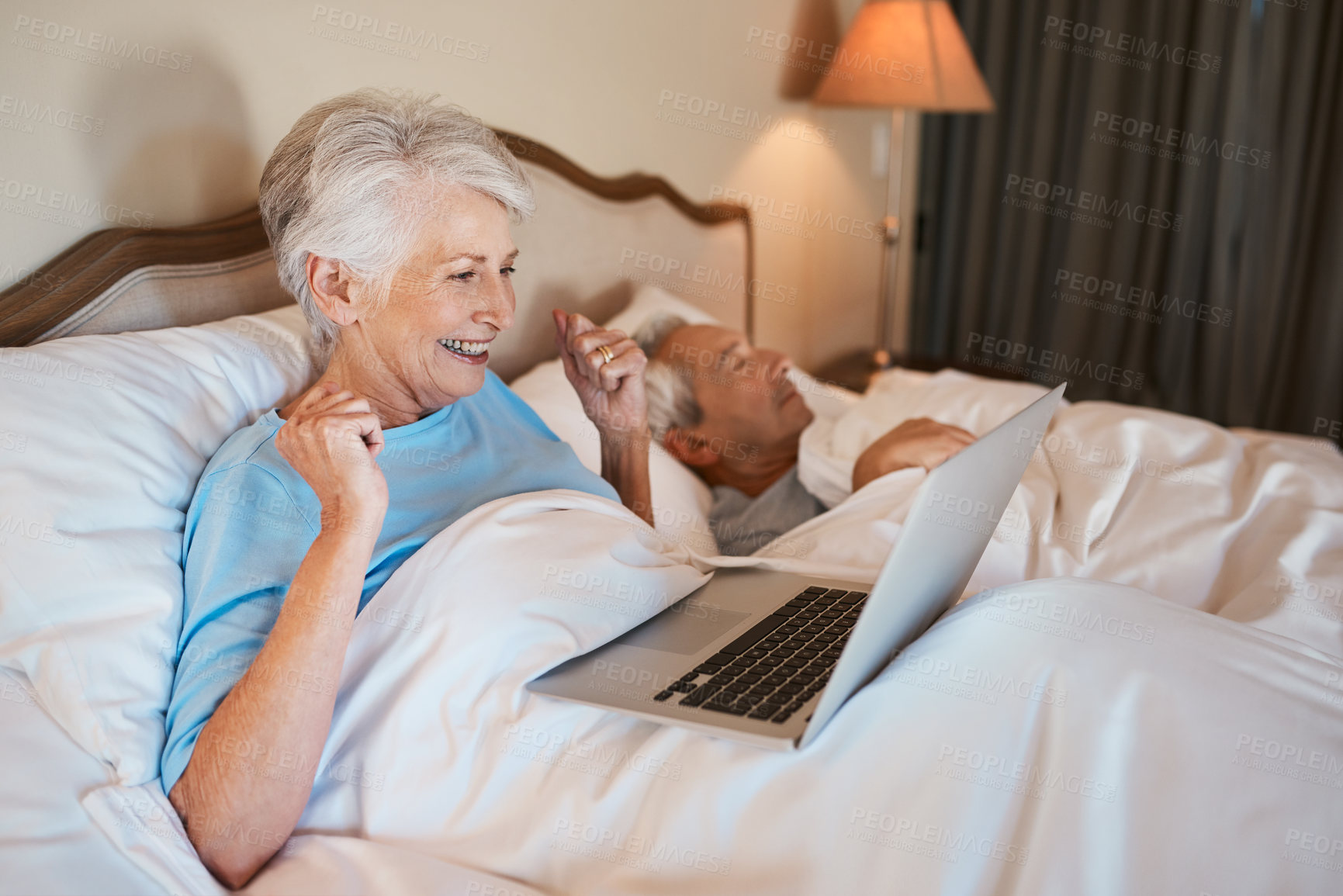 Buy stock photo Senior, happy woman and laptop with surprise in bed for good news, winning or promotion at home. Elderly, female person or winner with smile on computer for victory, lottery deal or prize in bedroom