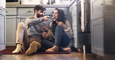 Buy stock photo Ice cream, kitchen and couple on floor in home for bonding, relaxing and quality time together. Love, relationship and happy man and woman with sweet treats, dessert and luxury snack for romance