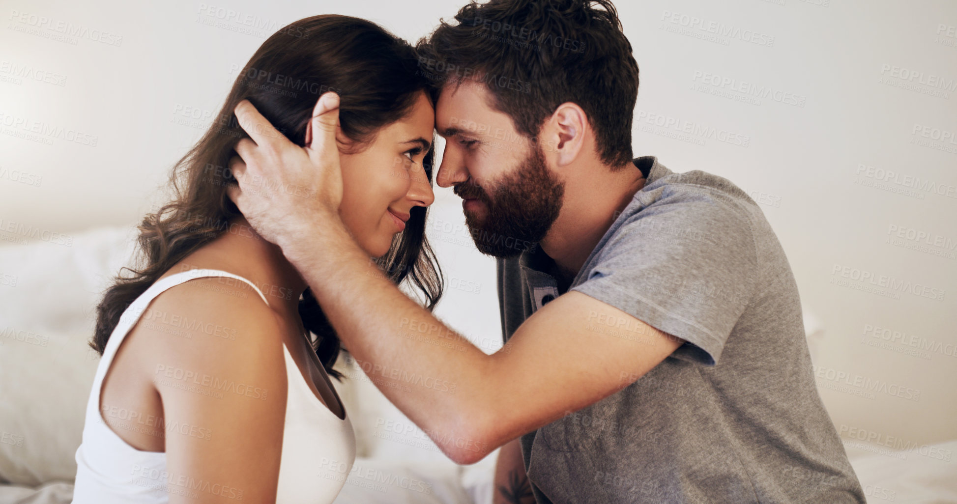 Buy stock photo Couple, people and home with forehead touch in bedroom with smile, together and support for unity. Relationship, happy and bonding for romance in morning for care, love and trust as soulmate