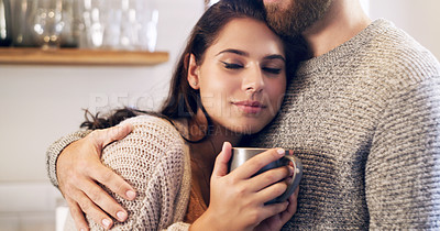 Buy stock photo Shot of a happy young couple having coffee together in the kitchen at home