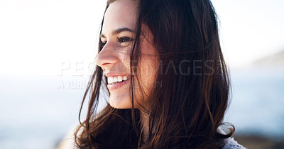 Buy stock photo Cropped shot of a beautiful young woman spending time outdoors