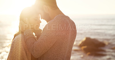 Buy stock photo Cropped shot of a young couple spending the day at the beach