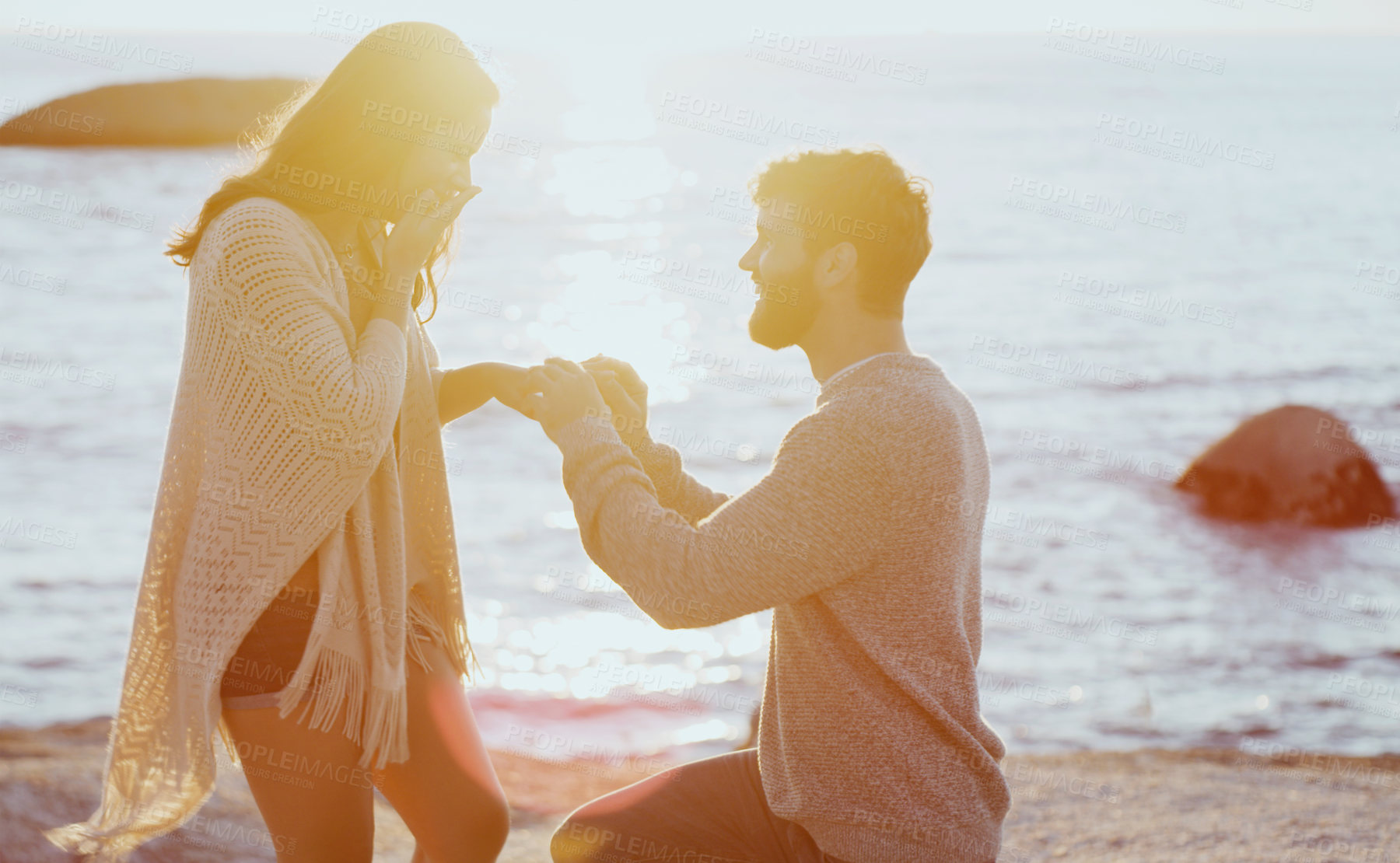 Buy stock photo Beach, sunset and couple with proposal for marriage on summer vacation, holiday or travel. Love, happy and young man and woman by ocean for romantic engagement surprise on weekend trip in Australia.