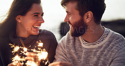 Buy stock photo Happy, couple and fireworks sparkle at celebration with happiness on holiday or vacation in summer. Fire, sparks and people excited for countdown to new year at party or event outdoor with love