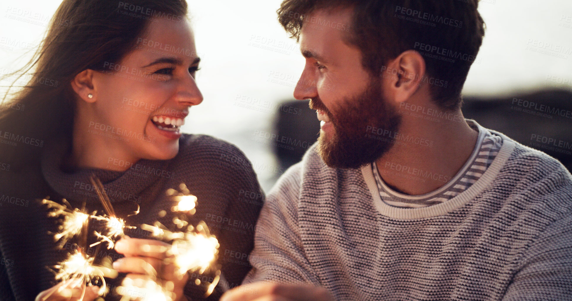 Buy stock photo Happy, couple and fireworks sparkle at celebration with happiness on holiday or vacation in summer. Fire, sparks and people excited for countdown to new year at party or event outdoor with love