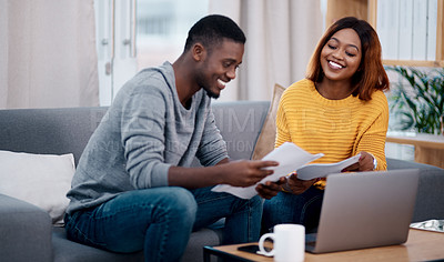 Buy stock photo Home, smile and black couple with paperwork, laptop and discussion with budget, conversation and planning funding. Partnership, man and woman with technology, talking and documents for investments