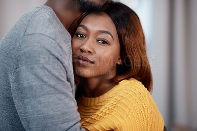 Buy stock photo Love, hug and portrait of black couple in home with support, trust and kindness in apartment together. Romance, man and happy woman embrace in living room with care, safety and relationship wellness.