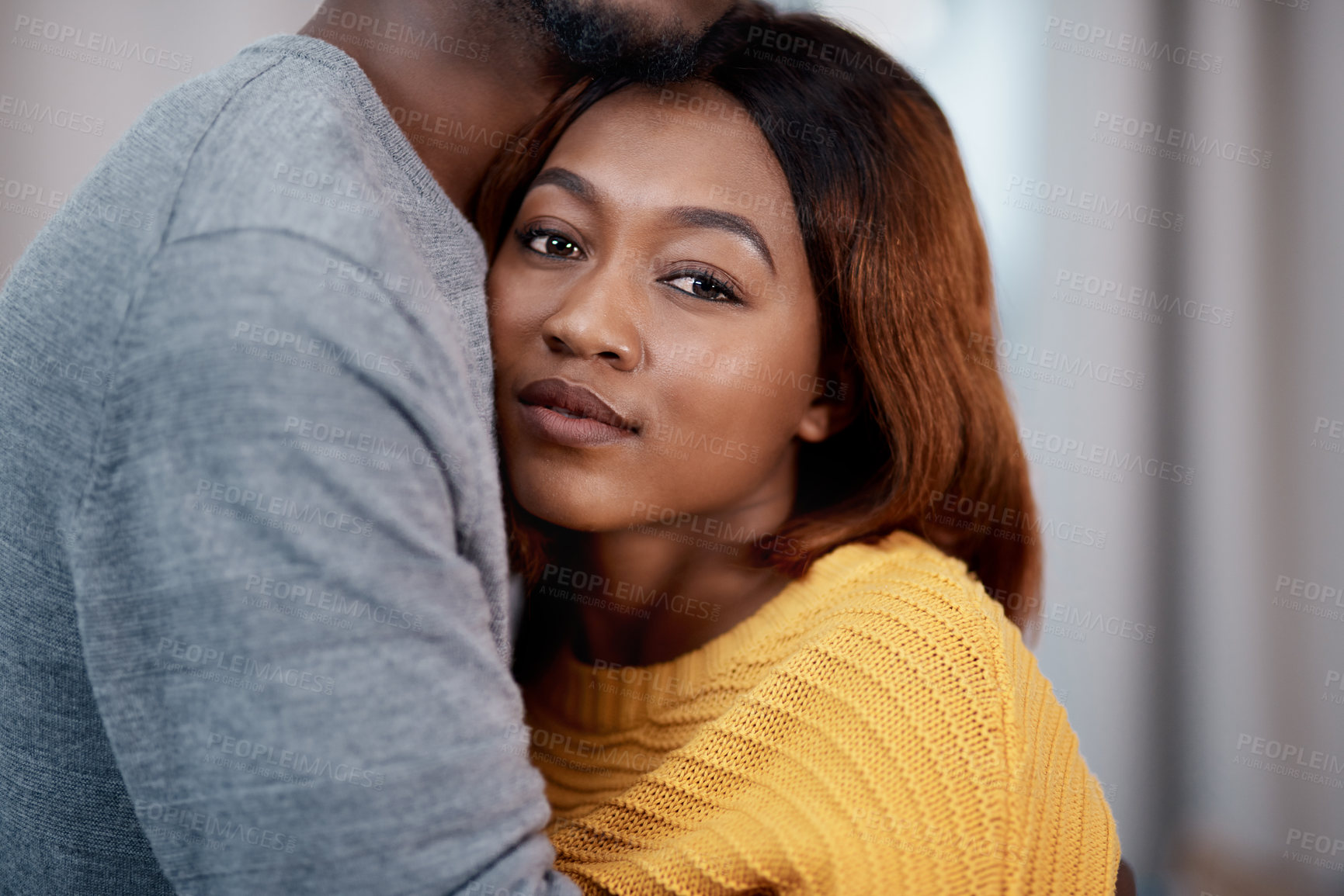 Buy stock photo Love, hug and portrait of black couple in home with support, trust and kindness in apartment together. Romance, man and happy woman embrace in living room with care, safety and relationship wellness.