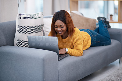 Buy stock photo Black woman, typing on laptop and relax on couch with internet search, blog and communication while at home. African female blogger in apartment, connectivity and writing on pc with browsing online