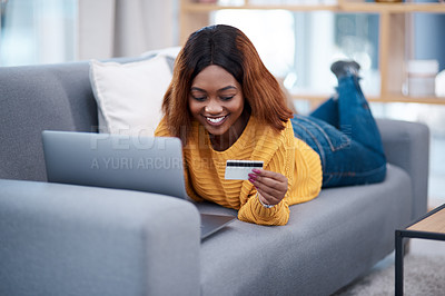 Buy stock photo Black woman, laptop and credit card with online shopping, e commerce with payment on store website and relax on sofa. Happy African female customer, bank app and finance with internet banking at home